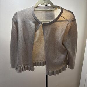 Retrology tan cardigan with ruffles details